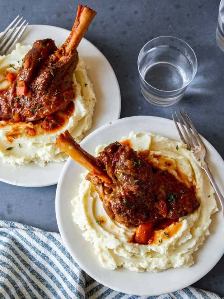 Braised lamb shanks over mashed potatoes.