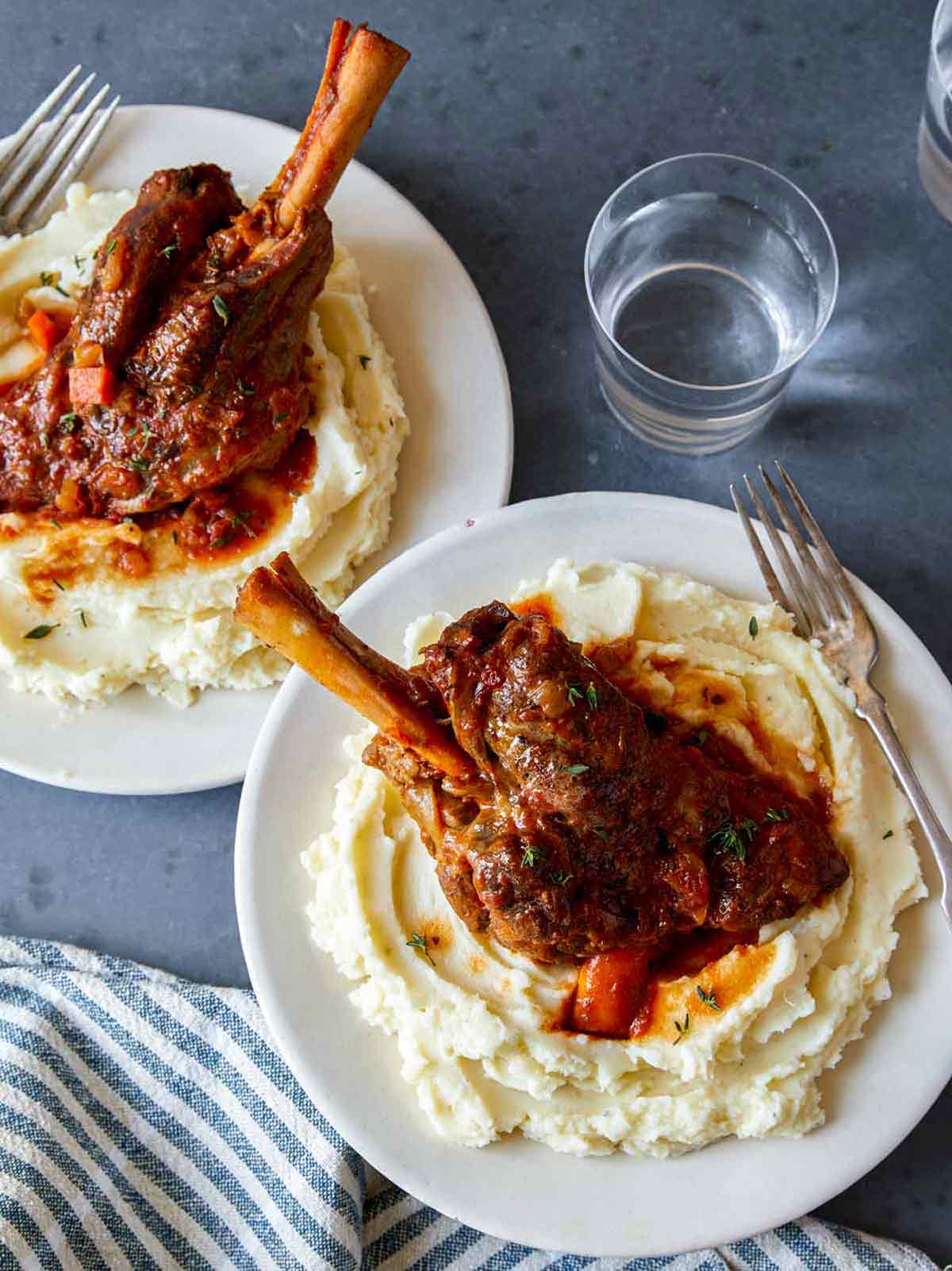 Braised lamb shanks over mashed potatoes, a romatic Valentine's dinner idea.