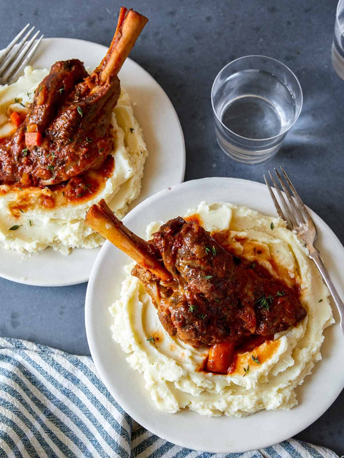 Braised lamb shanks over mashed potatoes. 