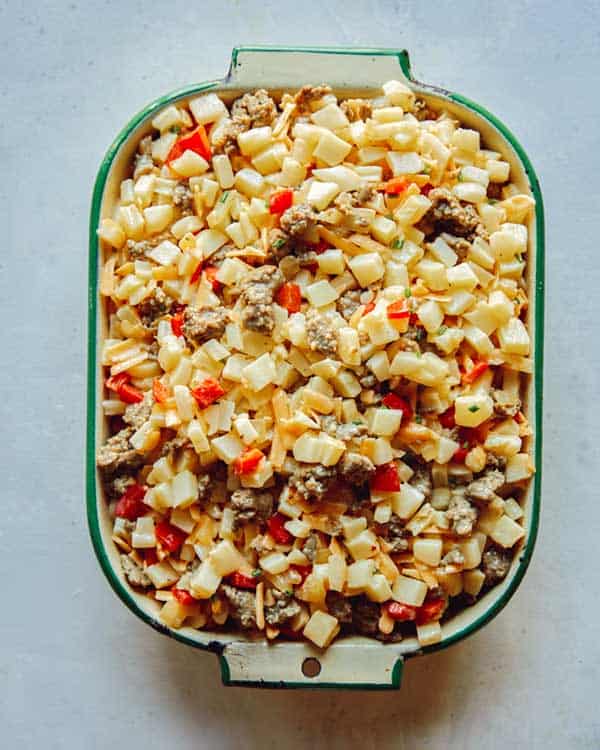 Breakfast casserole in a baking dish before it's baked.