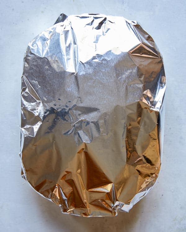 Breakfast casserole with tin foil on top.