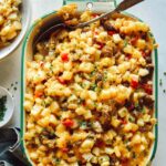 Breakfast casserole with a spoon in it.