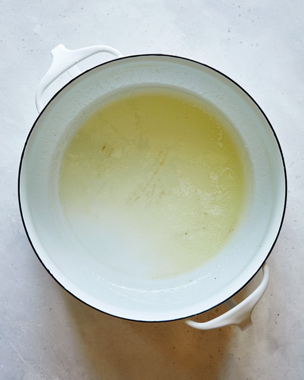 A pot of melted butter to make a the start of a soup recipe.