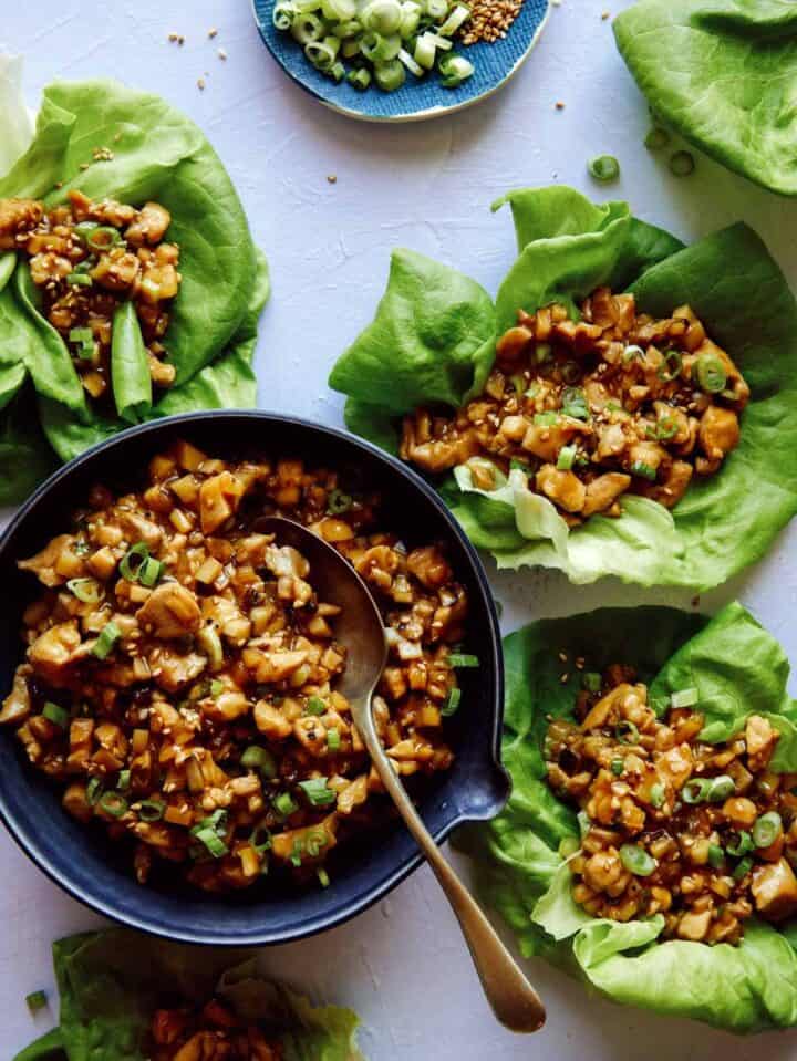 Chicken lettuce wraps with lettuce cups full of the chicken mixture, a healthy dinner ideas. 