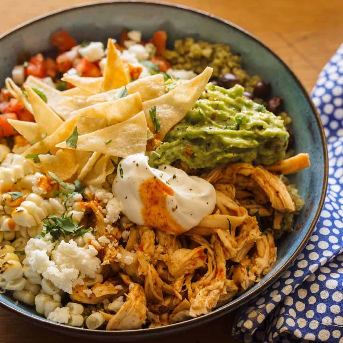 A close up of a honey chipotle chicken burrito bowl, a heathy dinner recipe.