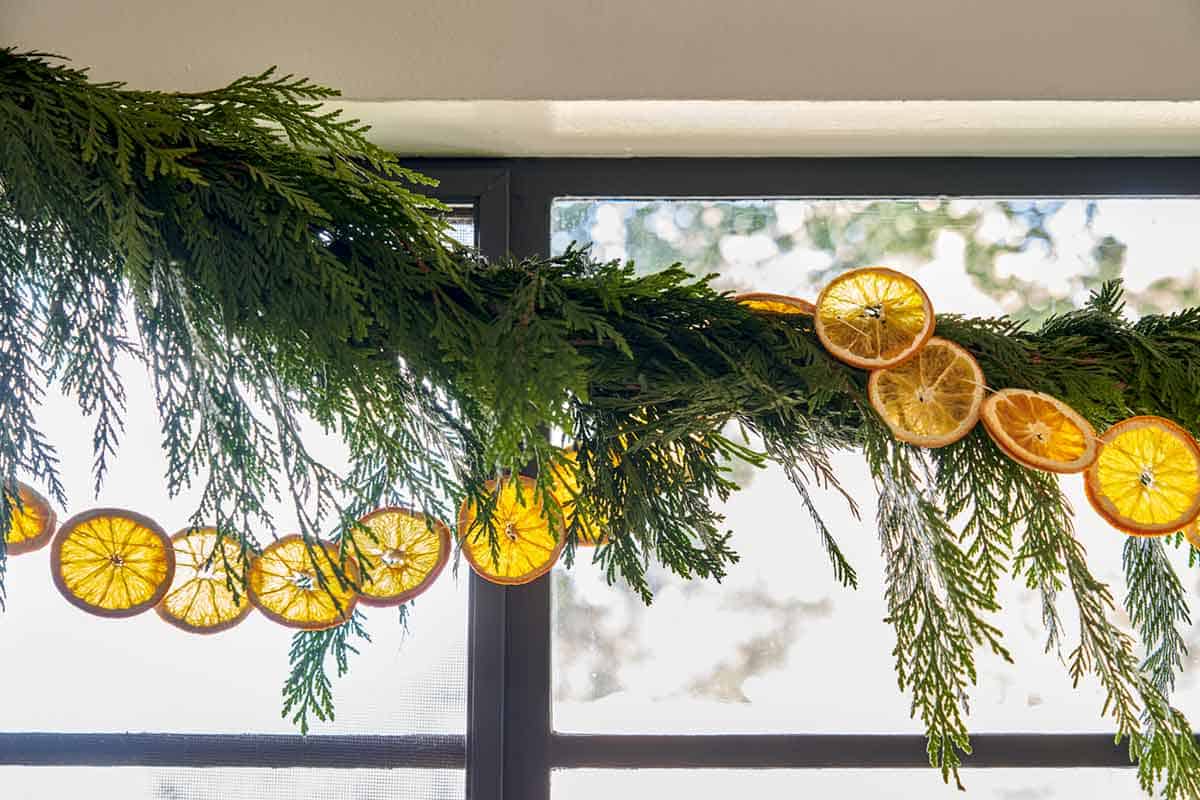 Citrus garland strung above a kitchen window. 