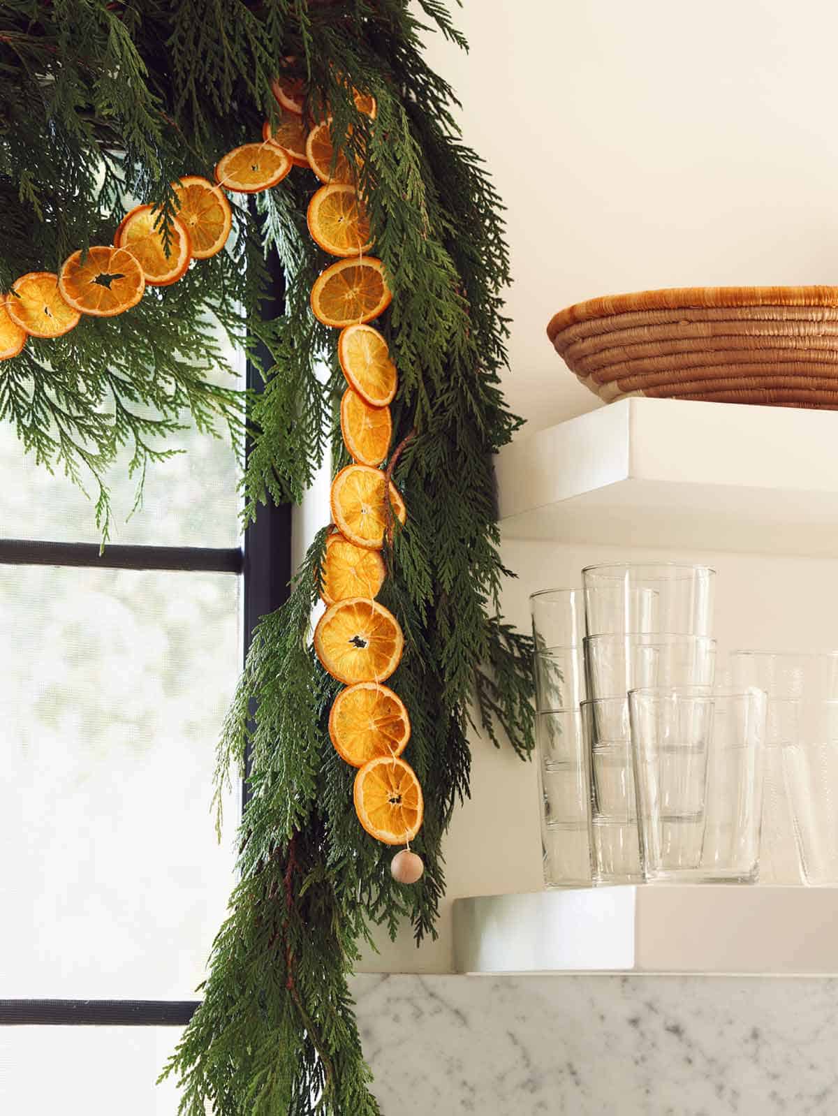 Close up on a dehydrated citrus garland in a kitchen.