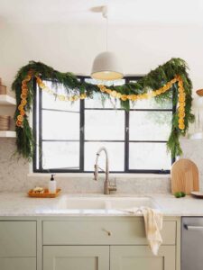 Dehydrated citrus garland strung up in a kitchen window.