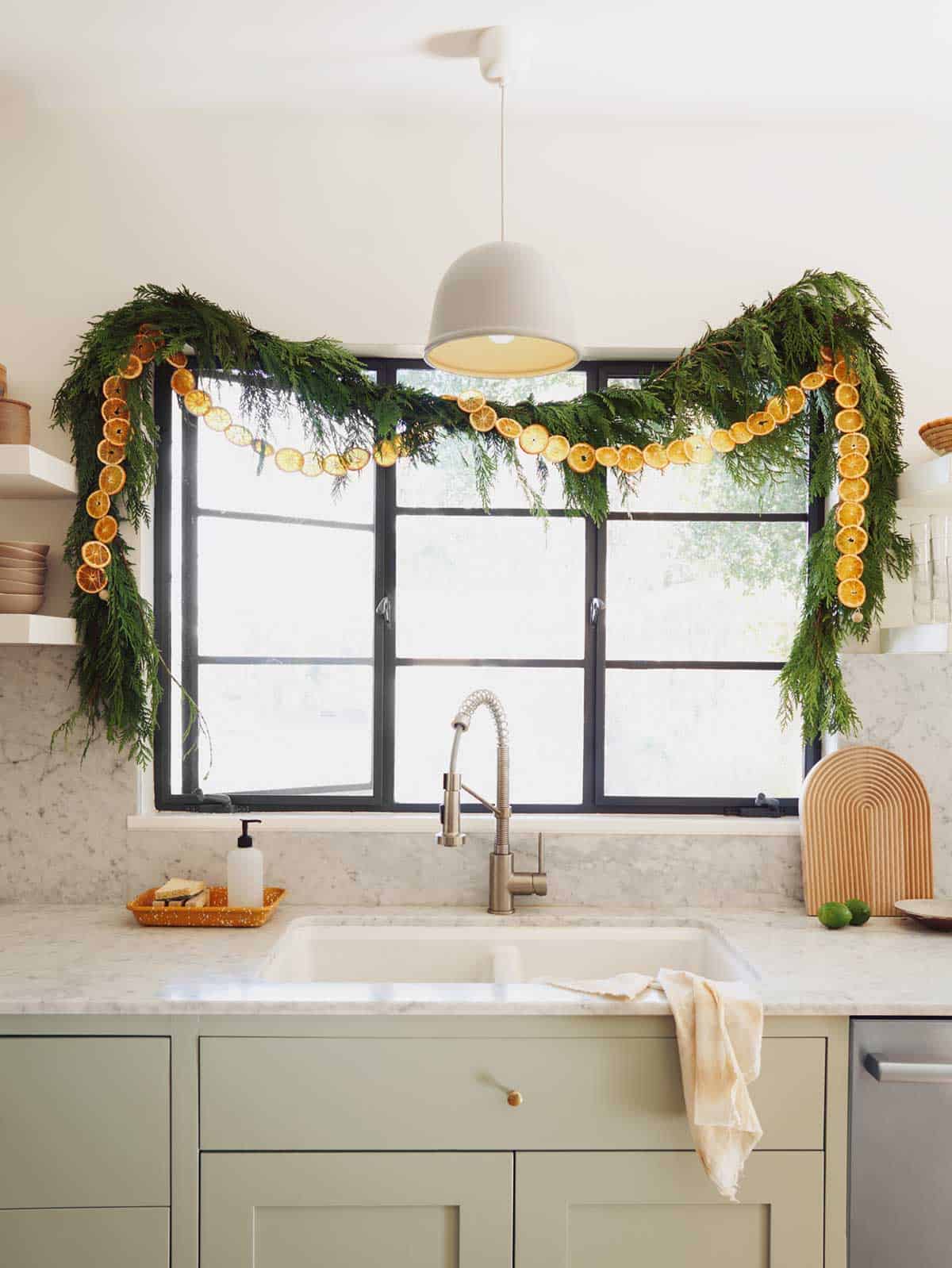 Dehydrated citrus garland above a kitchen sink.  