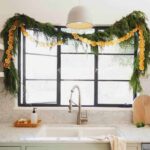 Dehydrated citrus garland strung up in a kitchen window.