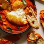 Fried Burrata Christmas Appetizer over romesco sauce.