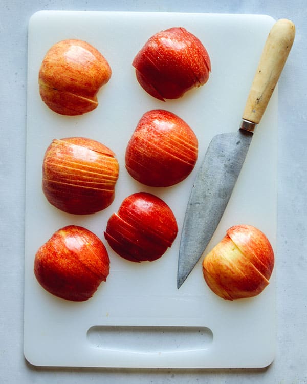 Thinly slice apples for german apple cake.