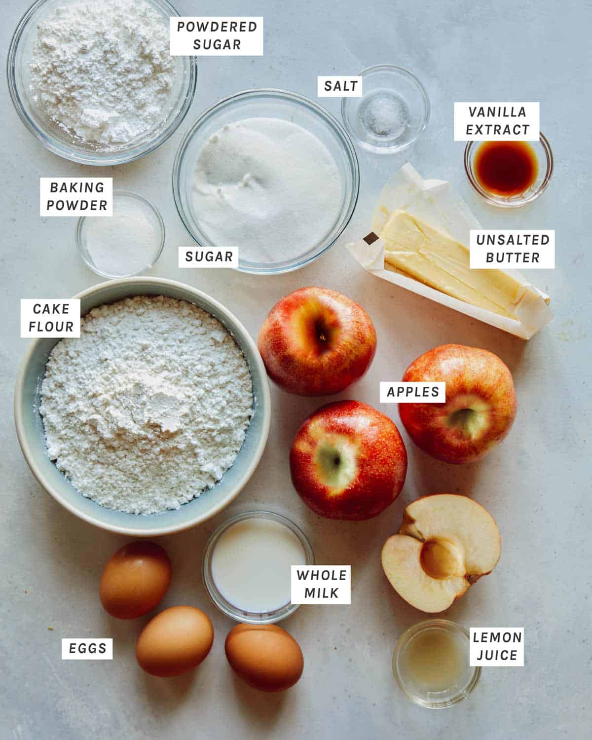 Ingredients for german apple cake all laid out on a kitchen counter.