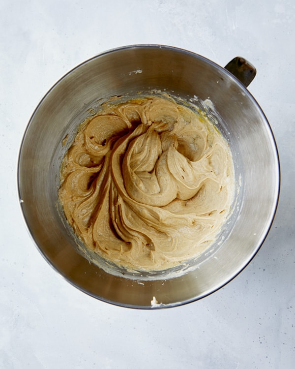 Creamed butter in a stand mixer bowl.