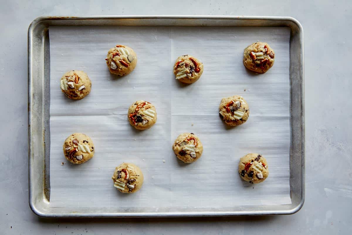 Cookie dough on a baking sheet ready to be baked.