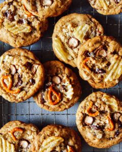 A close up of kitchen sink cookies on a cooling rack.