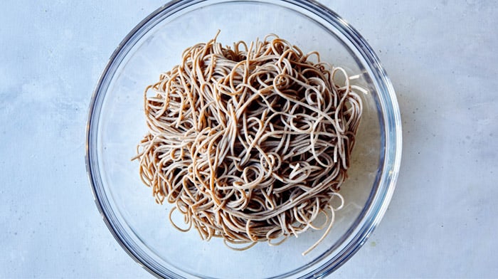Soba noodles drained and cooked in a bowl.