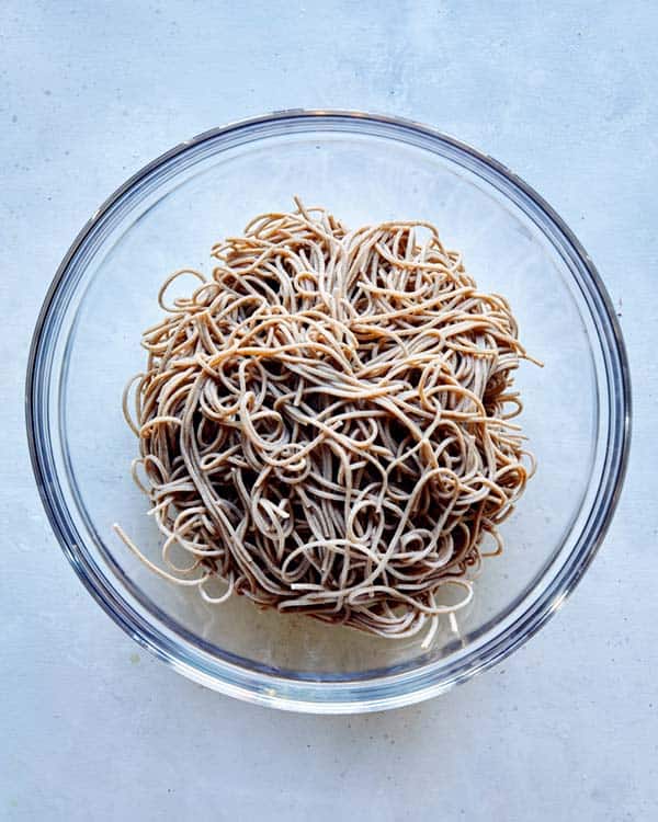 Soba noodles drained and cooked in a bowl.