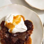 Sticky Toffee pudding recipe in two plates with a fork.