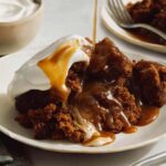 Sticky Toffee pudding recipe in two plates with a fork.