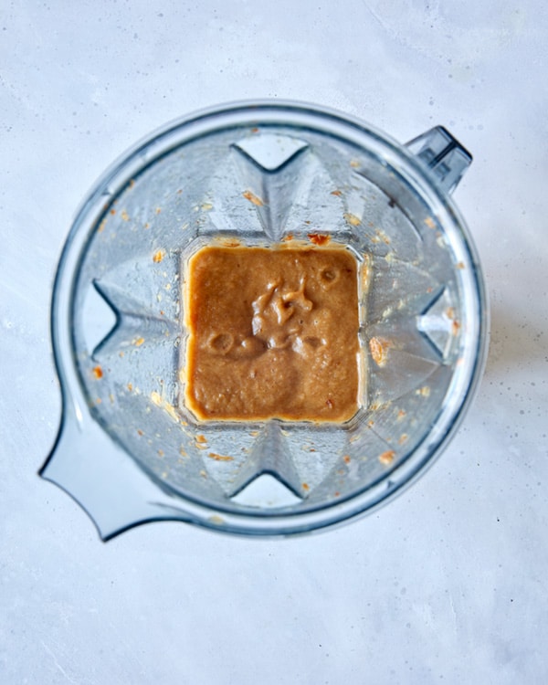 Dates pureed in a blender for sticky toffee pudding.