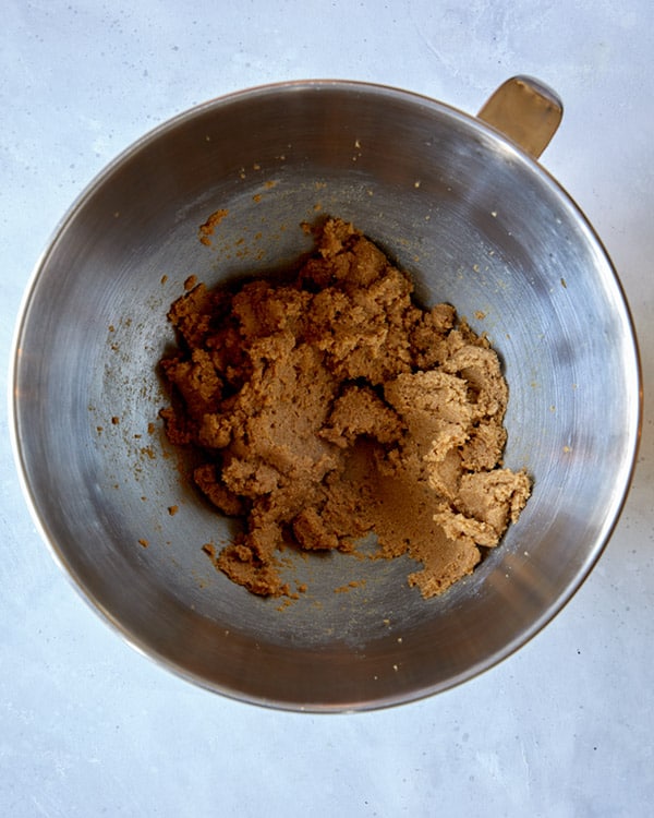Butter and sugar creamed together for sticky toffee pudding.
