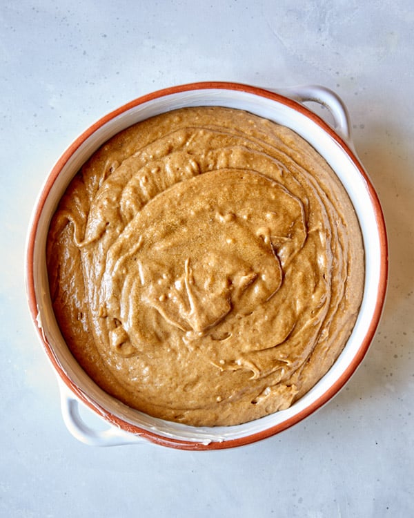 Sticky toffee pudding in a baking dish before it's baked.