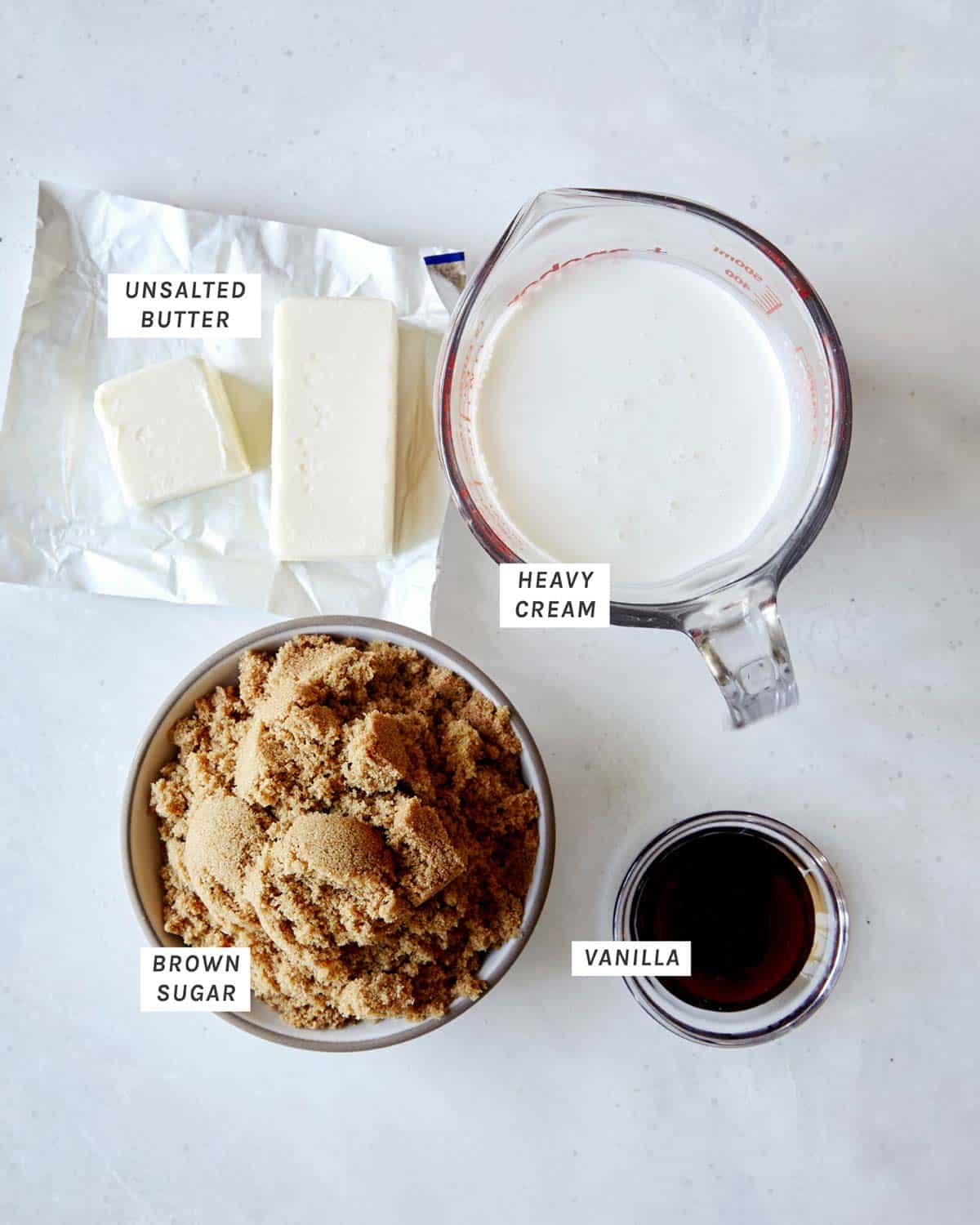 Sticky toffee pudding sauce ingredients on a kitchen counter. 