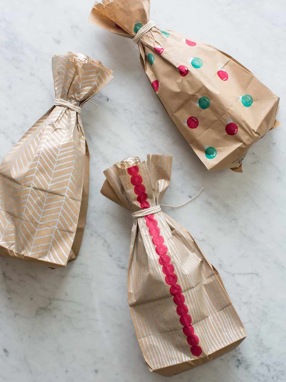 Several DIY wine wrapped bottles.