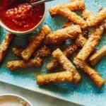 Wonton Mozzarella sticks on a platter, a new years eve appetizer recipe.