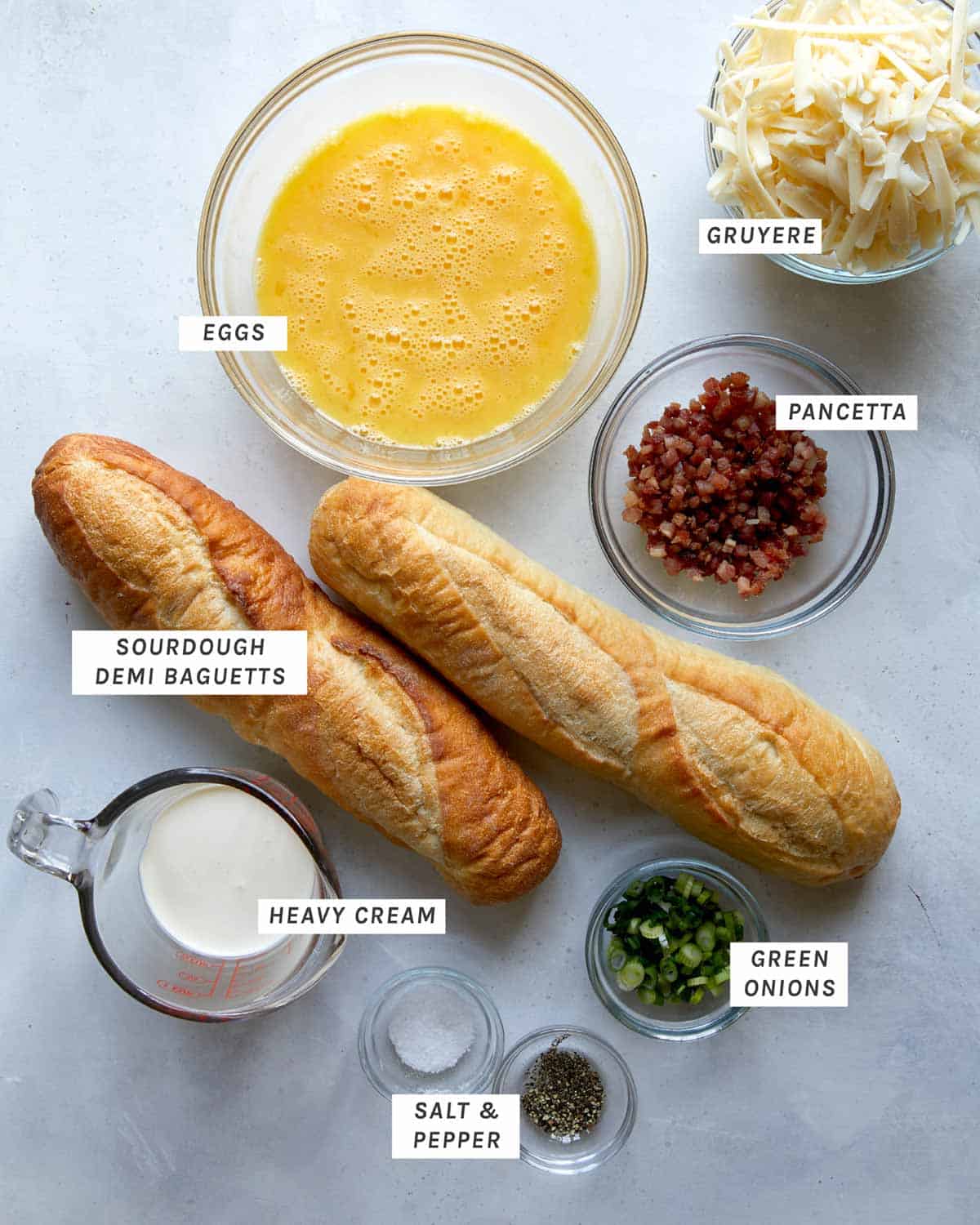 Baked egg boats ingredients laid out on a kitchen counter. 