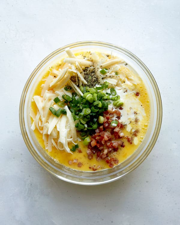 Baked egg boat ingredients in a mixing bowl.