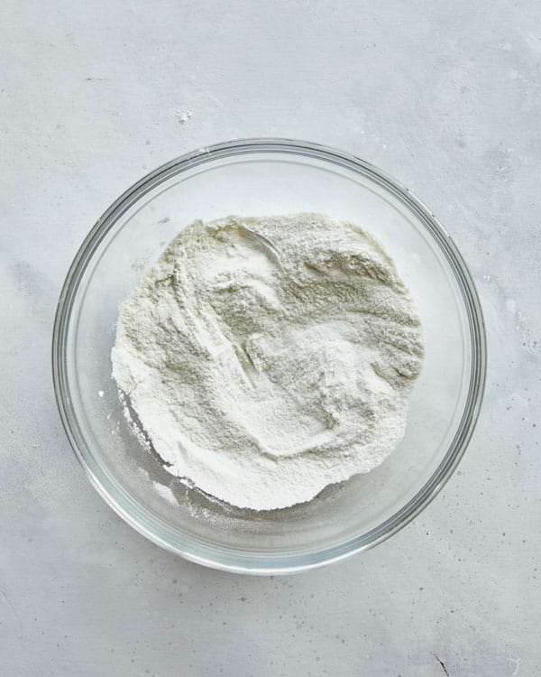 Dredging ingredients for buffalo cauliflower in a bowl.