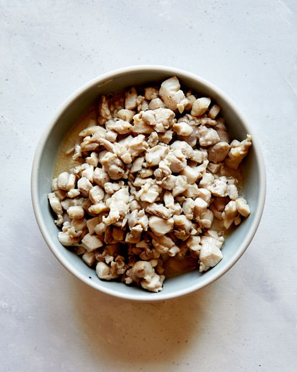 Diced chicken thighs in a bowl for chicken lettuce wraps.