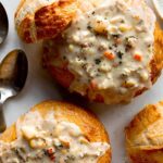 Close up on a bread bowl with clam chowder.