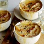 French Onion soup recipe in three bowls.