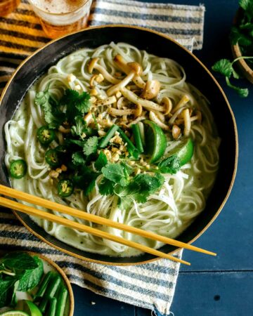 Green curry noodle soup in a bowl.