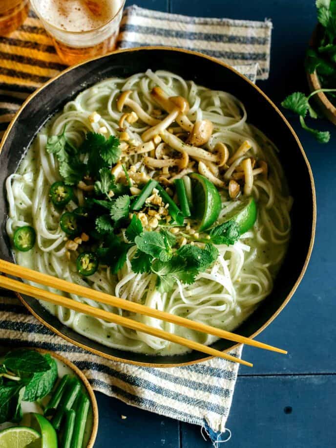 Green curry noodle soup recipe in a bowl.