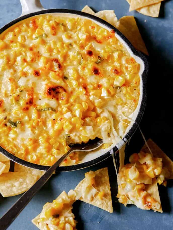 Korean cheesy corn in a skillet with chips. 