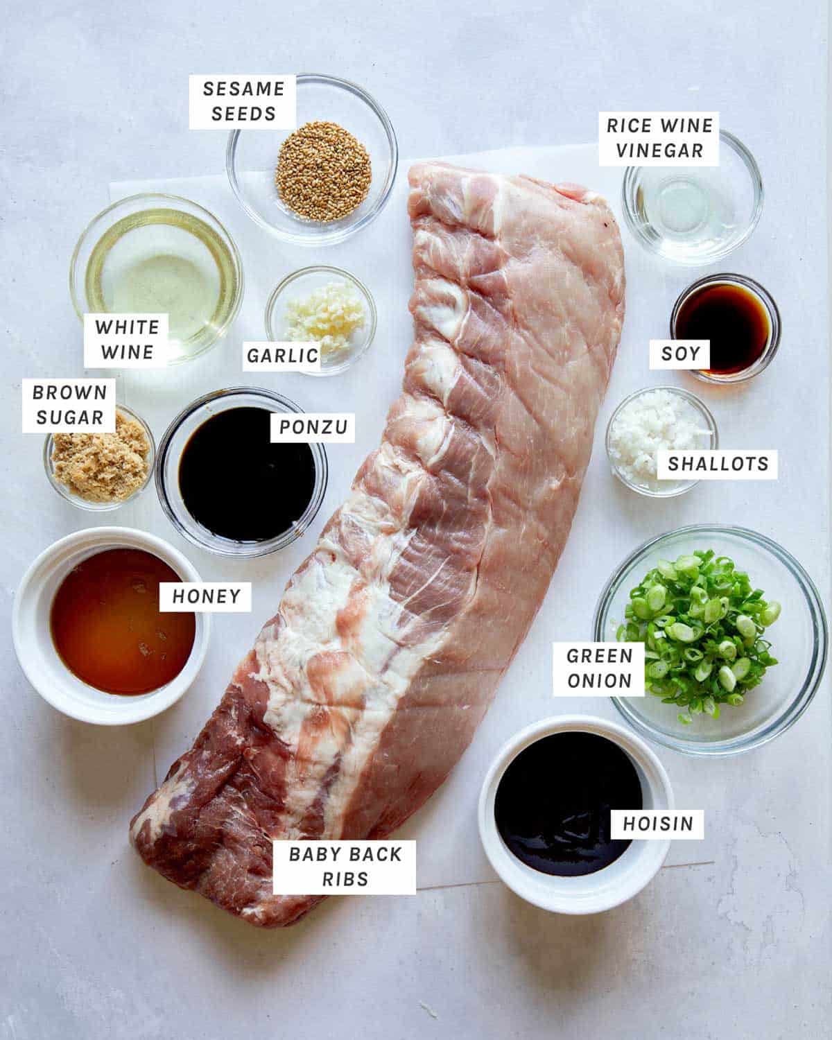 Ingredients for oven baked ribs on a kitchen counter.