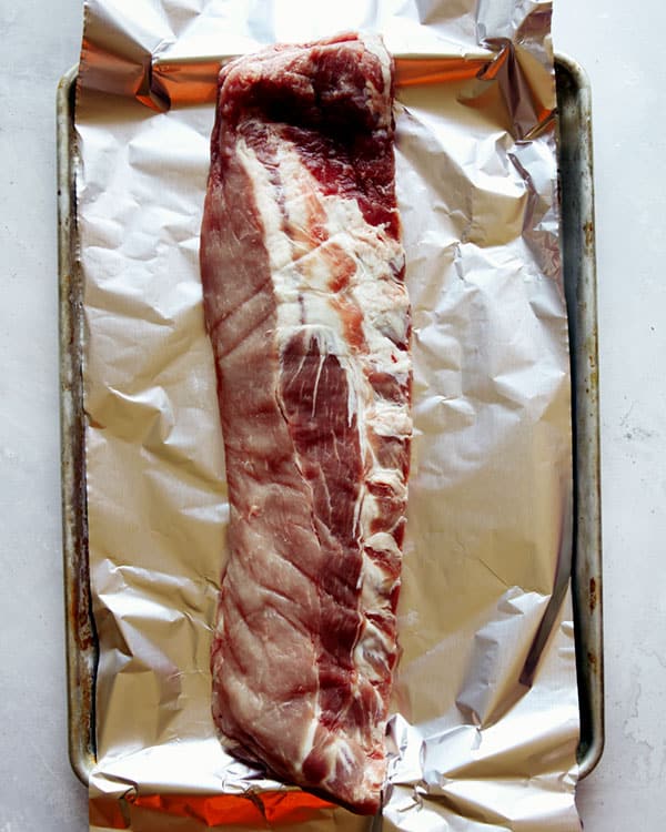 Ribs on a baking sheet with foil.