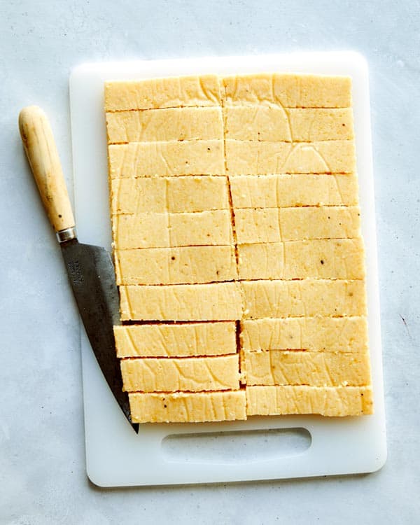 A slab of polenta cut up into french fries.