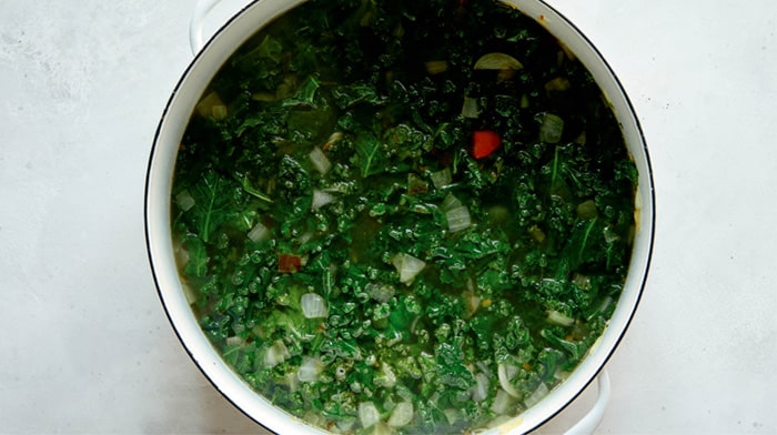 Tortellini soup in a stock pot simmering.