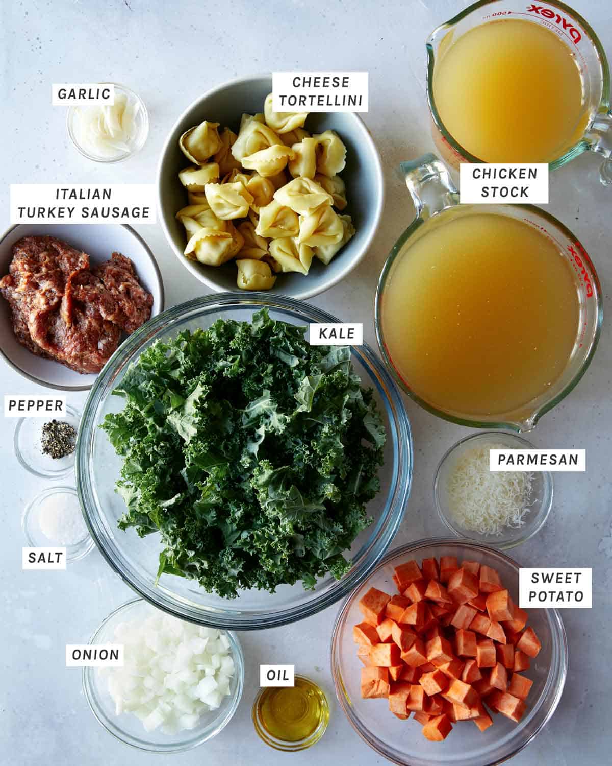 Ingredients laid out on a kitchen counter for Tortellini Soup. 