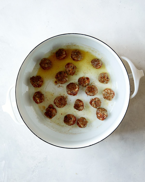 Turkey sausage meatballs seared in a stock pot for tortellini soup.