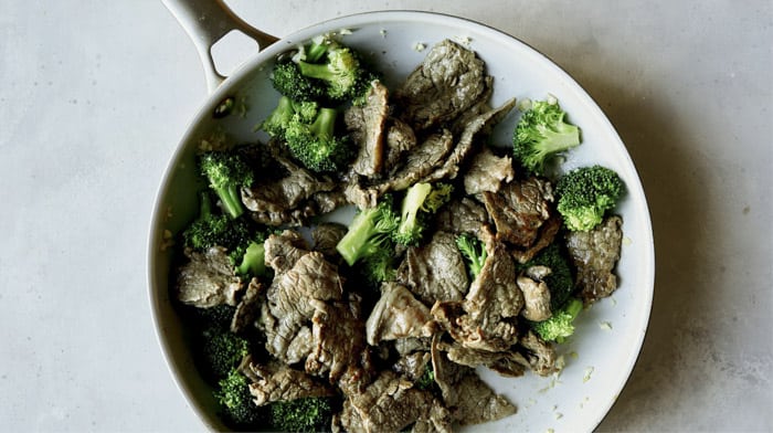 Broccoli and beef in a skillet.