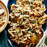 Beef Stroganoff on a platter with chives on top.