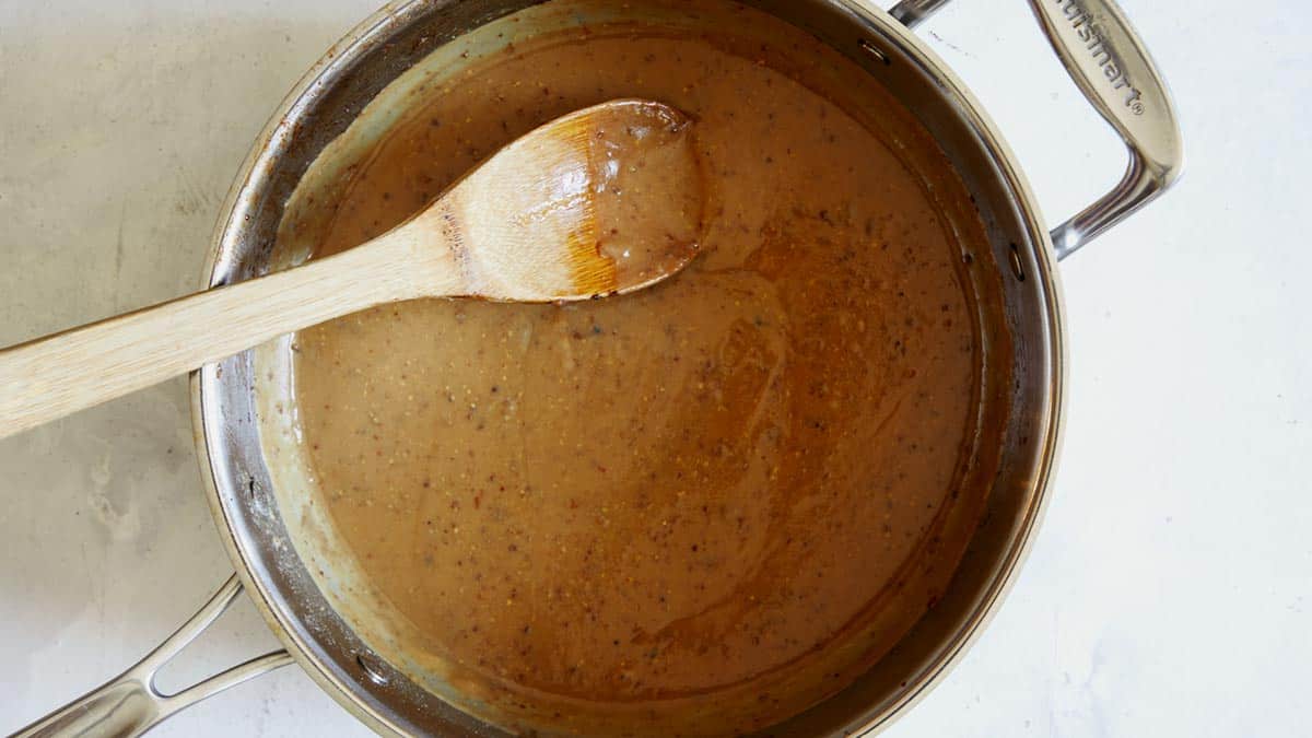 Beef stroganoff sauce being made in a skillet.