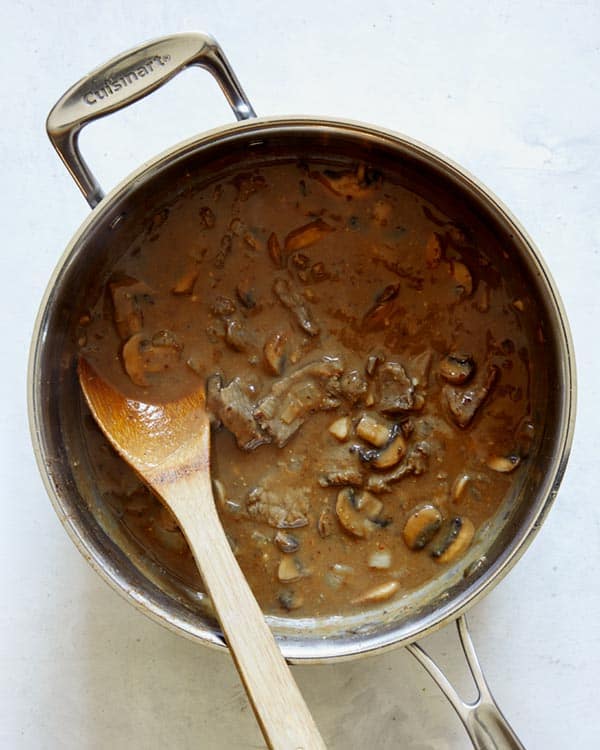 Beef stroganoff sauce and beef in a skillet.