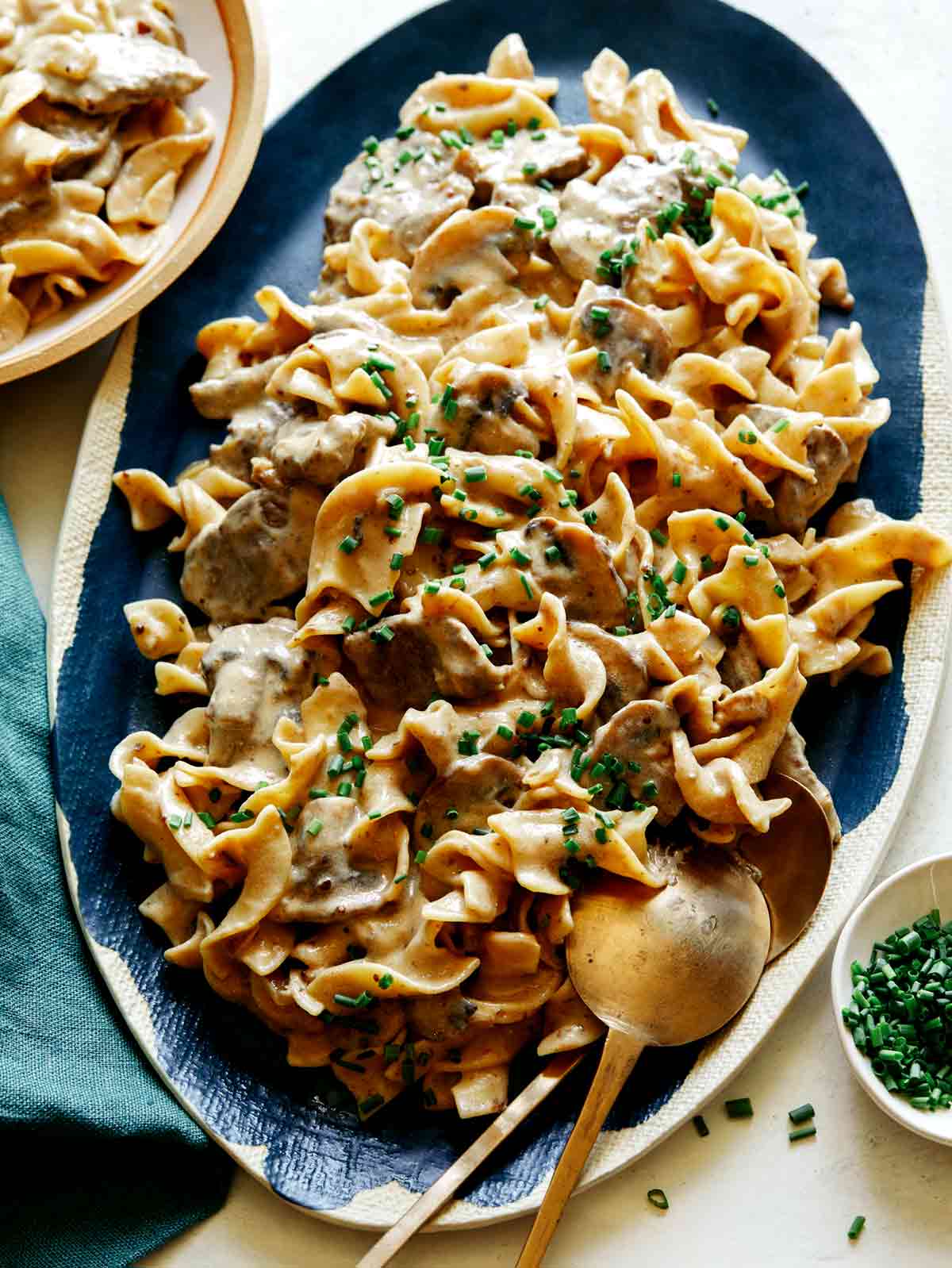 A recipe for Beef Stroganoff on a platter to be served.